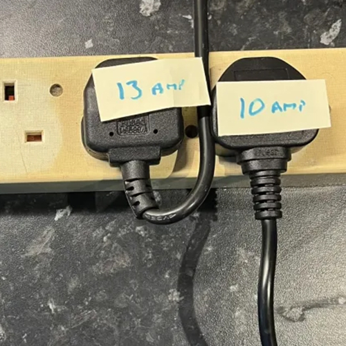 two plugs plugged into an extenstion cord